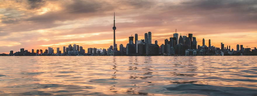 Skyline of Toronto next to Lake Ontario